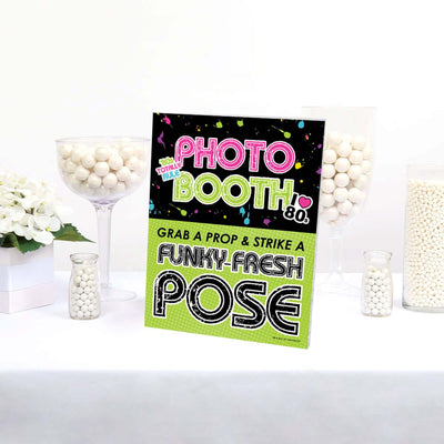 80's Retro Photo Booth Sign - Totally 1980s Party Decorations - Printed on Sturdy Plastic Material - 10.5 x 13.75 inches - Sign with Stand - 1 Piece