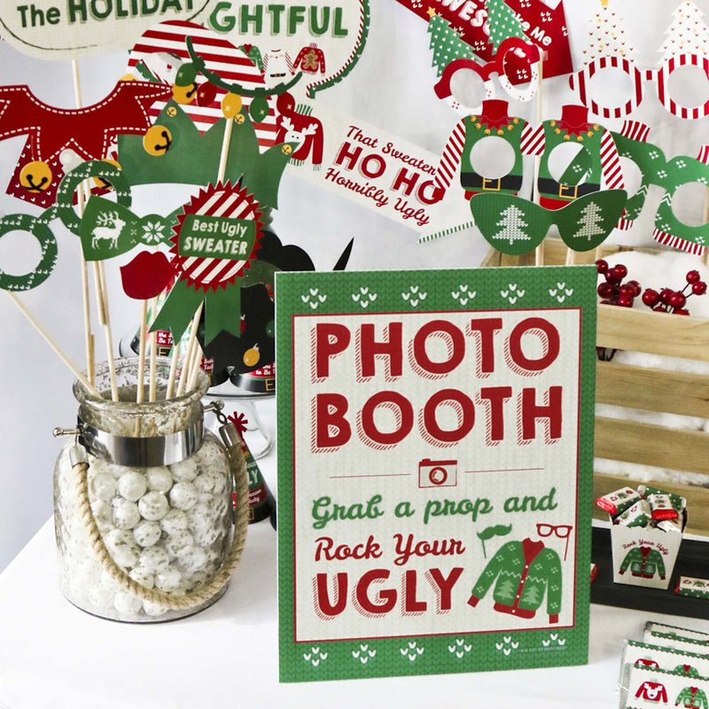 Ugly Sweater Photo Booth Sign - Holiday and Christmas Party Decorations - Printed on Sturdy Plastic Material - 10.5 x 13.75 inches - Sign with Stand - 1 Piece