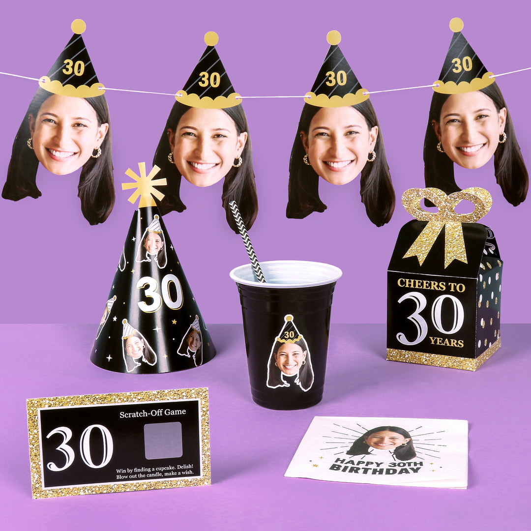 Birthday party decorations with photo booth hats, cup, and scratch-off game on a purple background