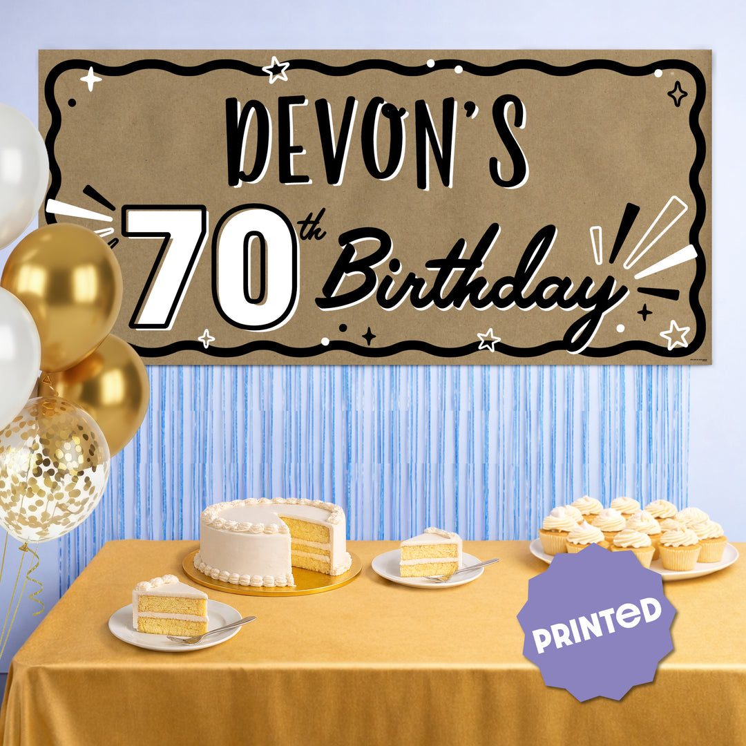 70th birthday party backdrop behind dessert table