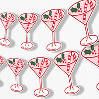Banner Christmas-themed cocktail glasses with candy canes and holly leaves on a white background.