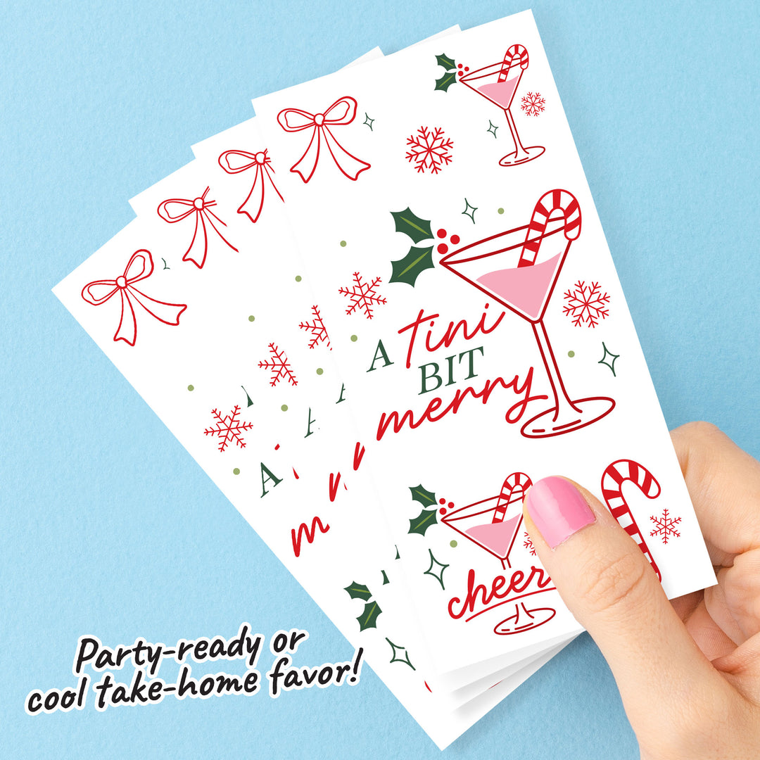 A Titni Bit Merry  themed temporary tattoos with festive designs on a blue background
