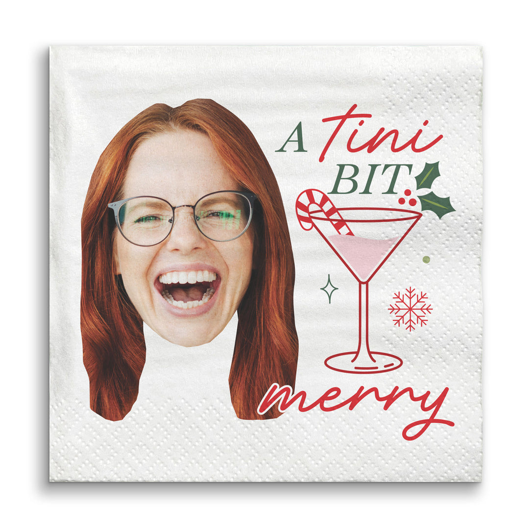 Napkin with a face print and festive text and graphics on a white background