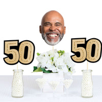 50th birthday dessert table with custom face and number decor