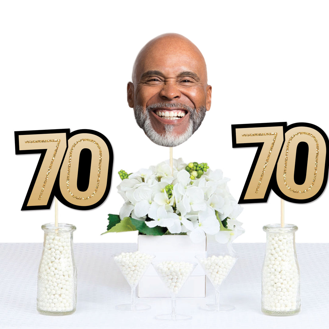 70th birthday celebration table styled with custom face decor