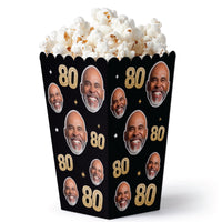 Popcorn bucket with faces and '80' text on a black background