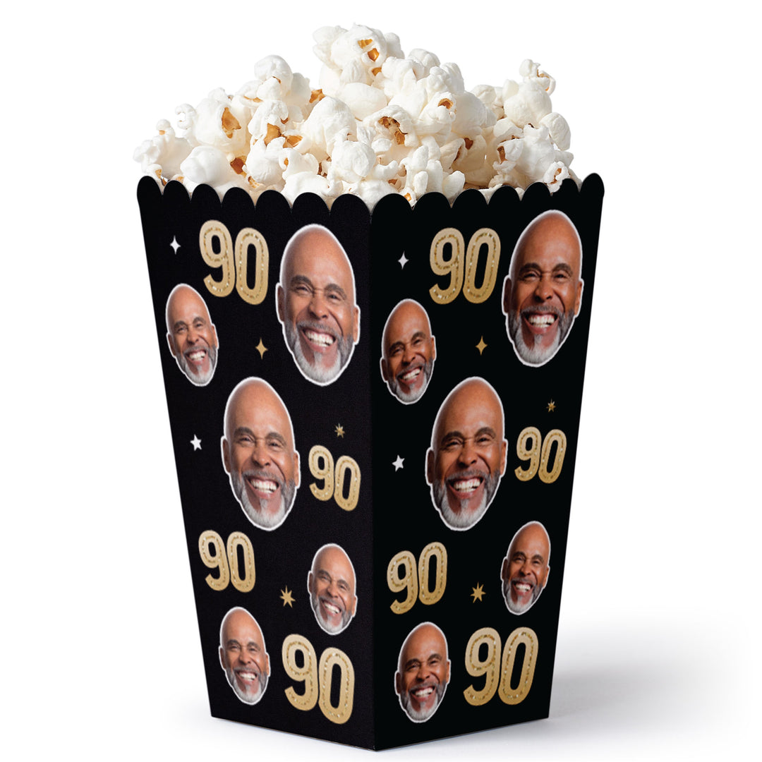 90th birthday celebration snack table with custom face popcorn boxes