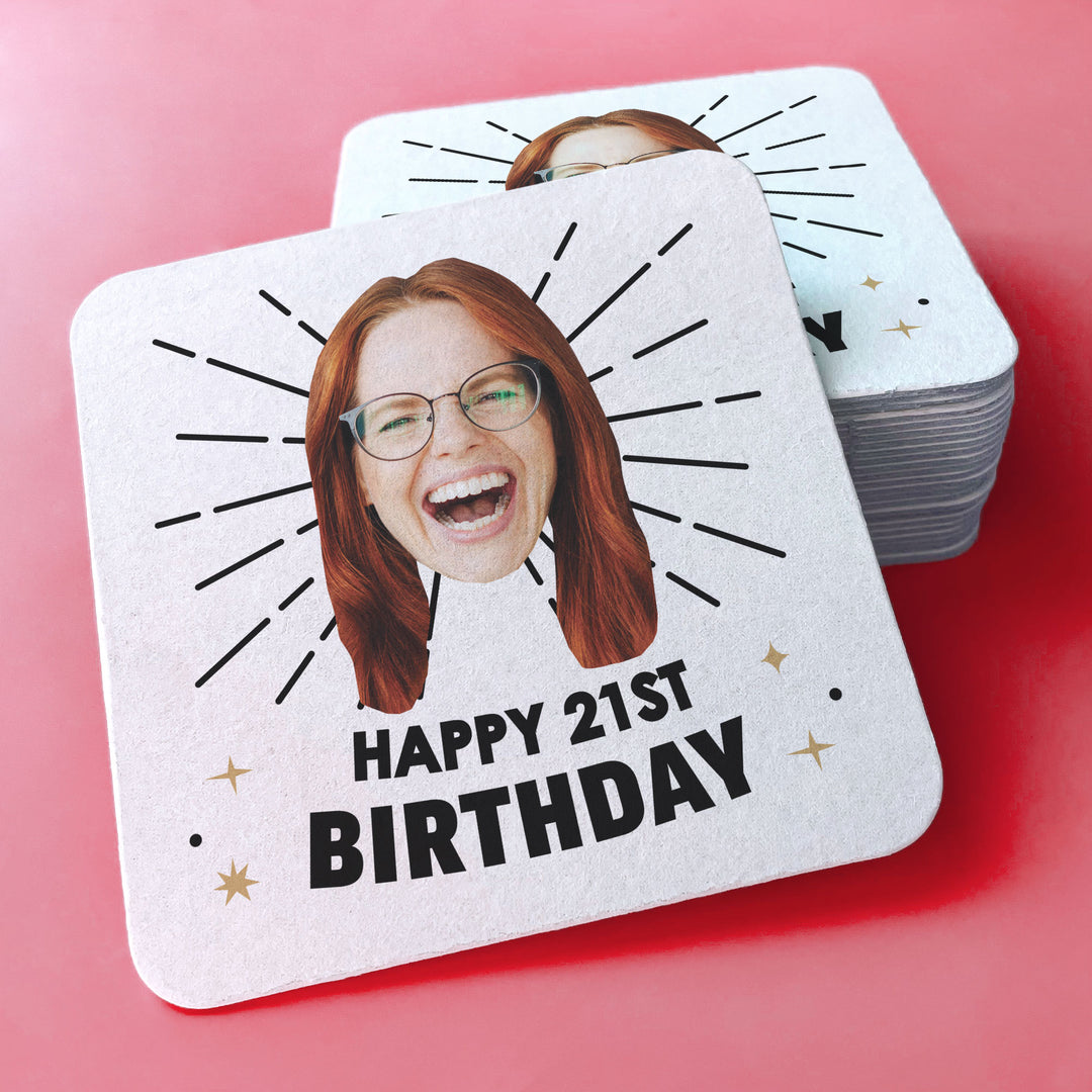 Personalized coaster with a photo of a person and 'Happy 21st Birthday' text on a pink background.