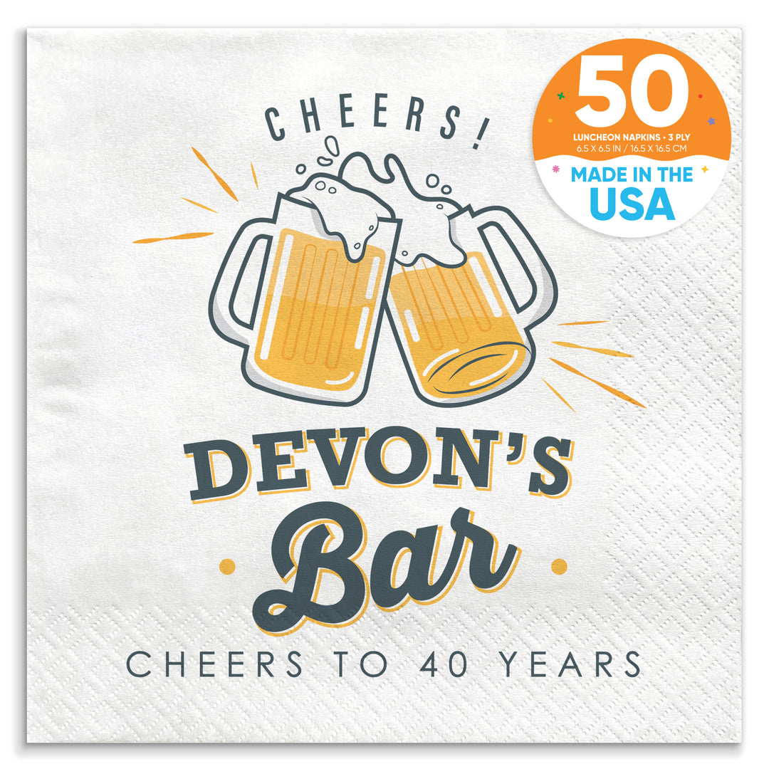 A custom text napkin with 'CHEERS! Devon's Bar CHEERS TO 40 YEARS' printed on it, featuring two clinking beer mugs.