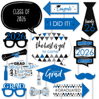 Collection of blue graduation-themed photo booth props with text and graphics on a white background.