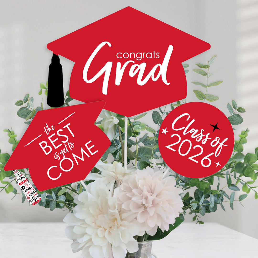 Graduation-themed decorations with 'Congrats Grad' and 'Class of 2026' on a floral background.