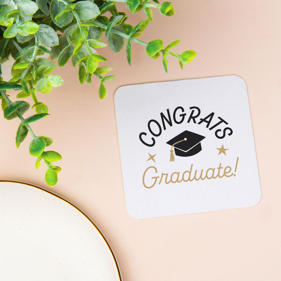 Black and white graduation cap coaster close-up