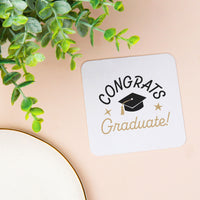 Black and white graduation cap coaster close-up