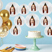 Custom birthday face paper fans styled as dessert table backdrop decor