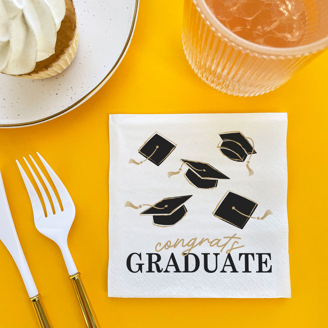 24-count Black and Gold graduation napkins display