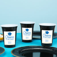 Blue personalized graduation cups at celebration table