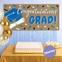 Blue graduation banner used as party backdrop