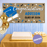 Blue graduation banner hanging at party
