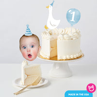 Baby boy first birthday cake with goose topper