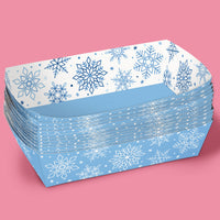Stack of blue food trays with snowflake pattern on a pink background
