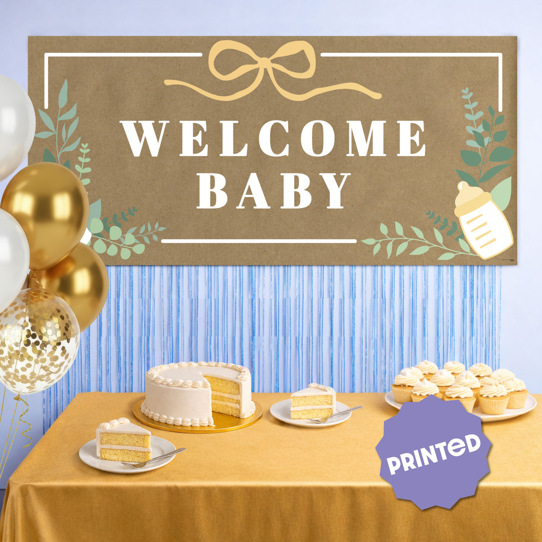 Botanical baby shower banner styled behind dessert table