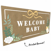 Close-up of greenery and floral details on baby banner