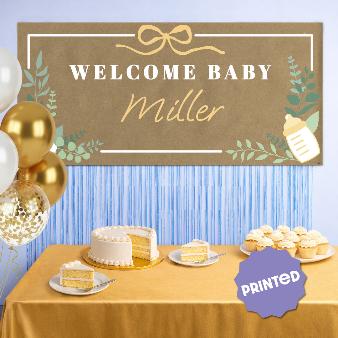 Botanical baby shower banner styled behind gift table