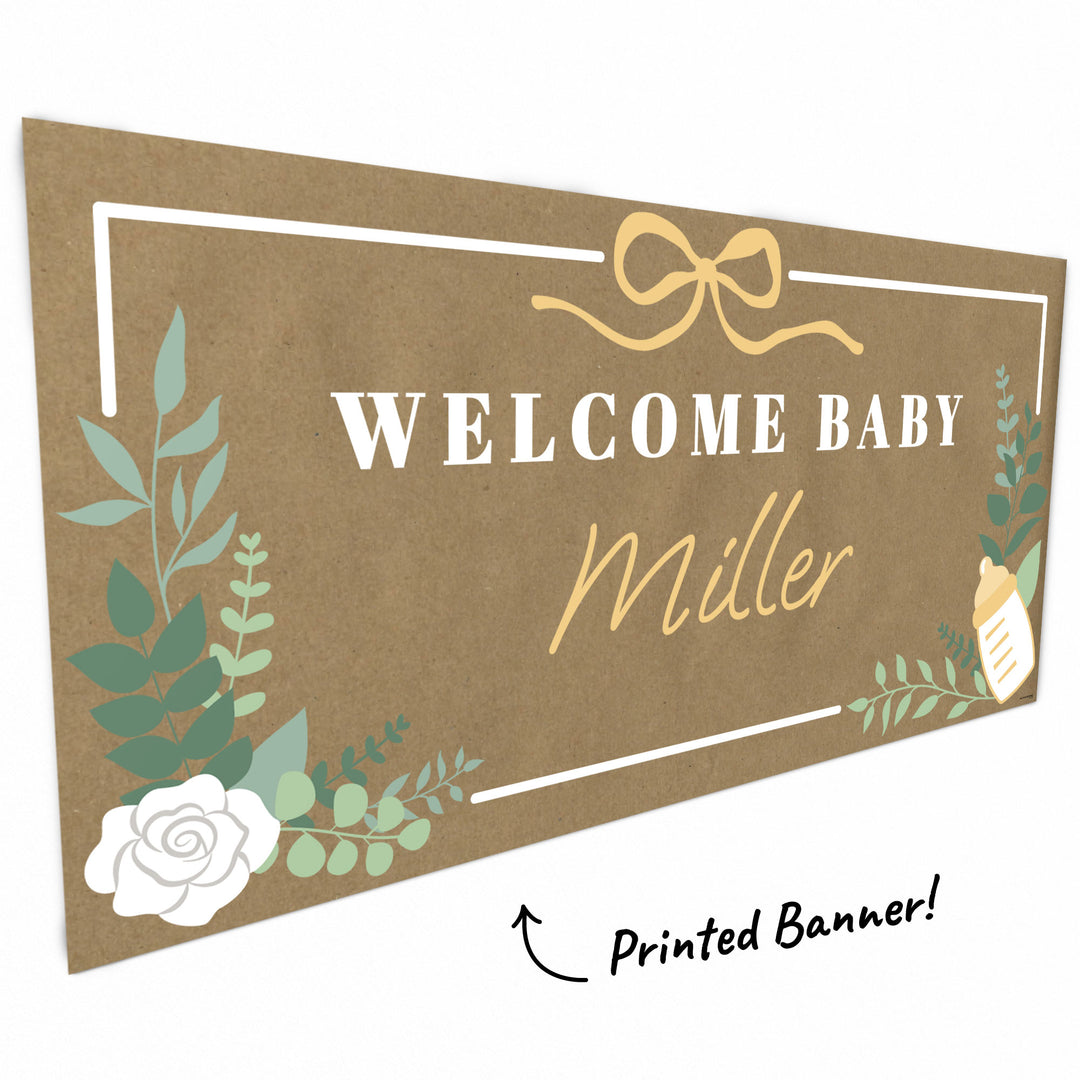Greenery and floral artwork close-up on welcome baby banner