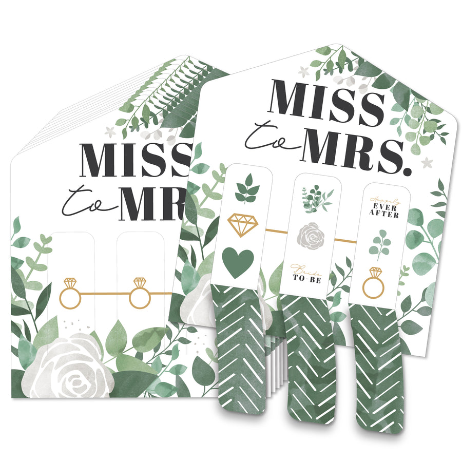 A set of bridal shower game cards with 'Miss to Mrs.' text and greenery illustrations.
