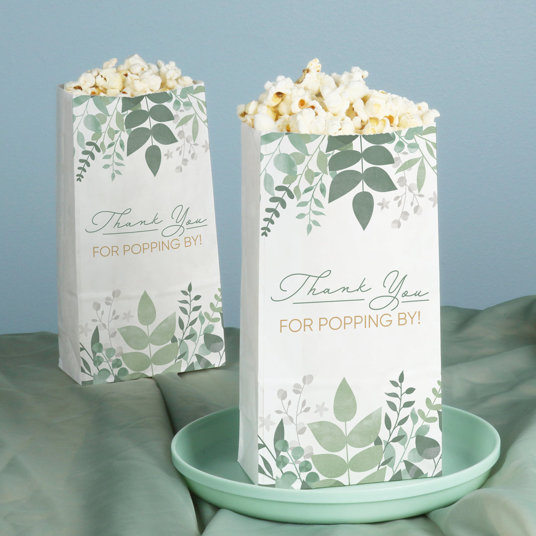 Two popcorn bags with leaf patterns and 'Thank You FOR POPPING BY!' text on a light blue background.