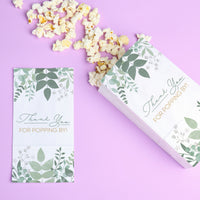 Popcorn box and card with leaf pattern on a purple background