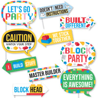 Colorful building blocks party-themed photo props with various sayings on a white background