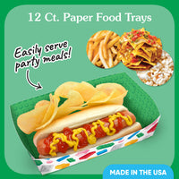 Block-themed paper food trays with a hot dog, chips, and nachos on a green background.