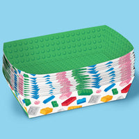 Stack of colorful building block-themed paper plates on a blue background