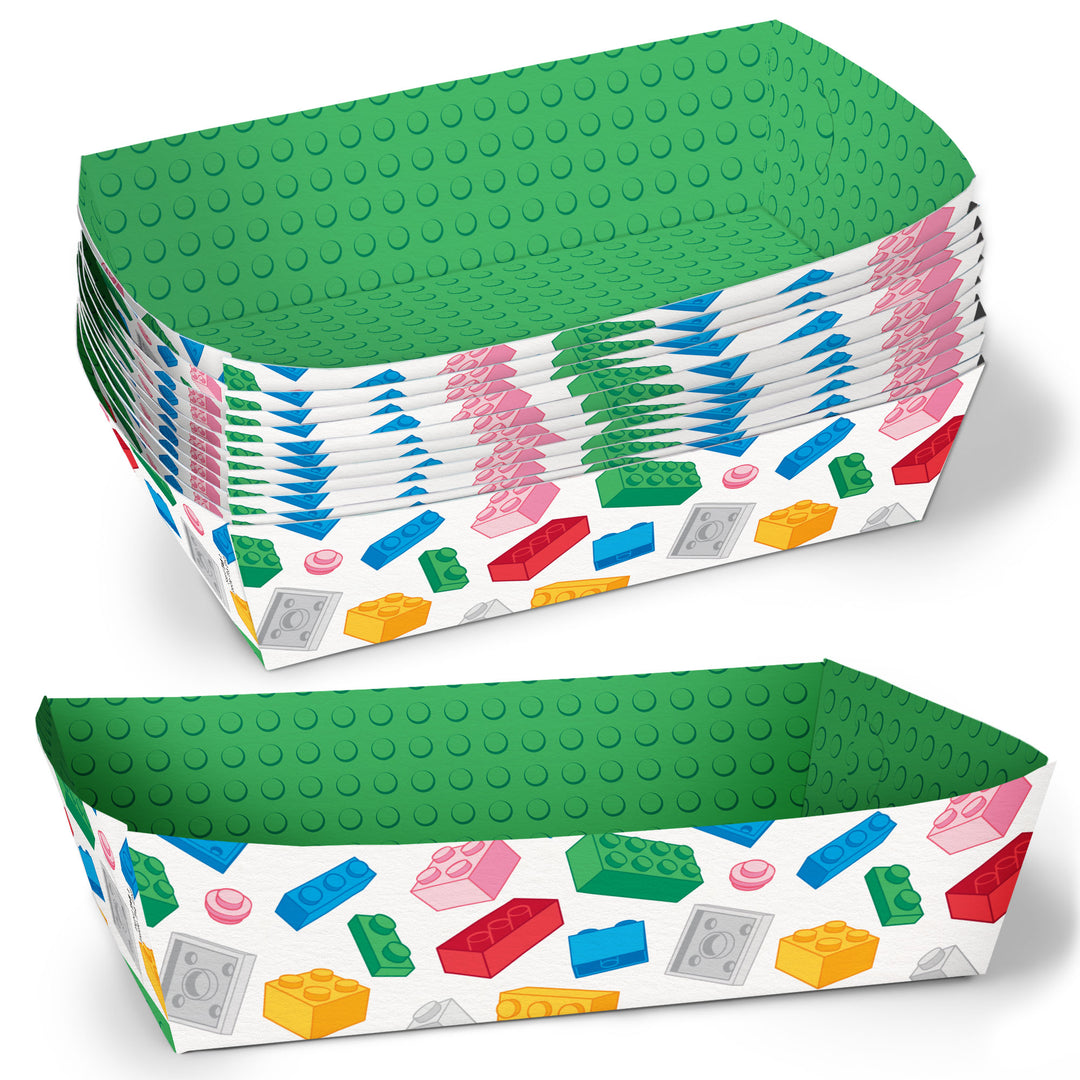 Stack of green and white paper food trays with a colorful building block pattern  for a kids birthday on a white background