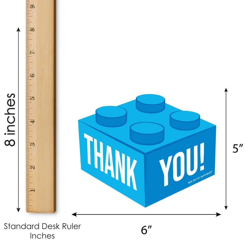 Blue brick-shaped thank you card with 'THANK YOU!' for Birthday party text, shown with a ruler for scale on a white background.