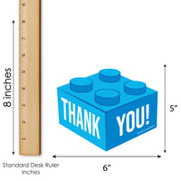 Blue brick-shaped thank you card with 'THANK YOU!' for Birthday party text, shown with a ruler for scale on a white background.