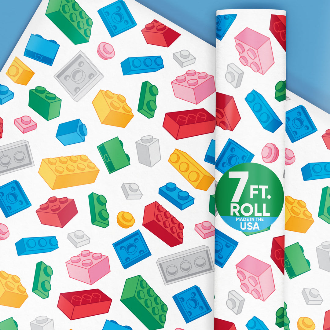 Colorful building block pattern on a roll of wrapping paper for gifts with '7 ft. Roll' text.