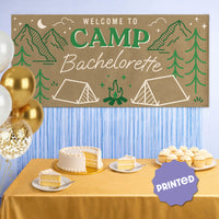 Welcome to Camp Bachelorette banner styled at cabin girls weekend party