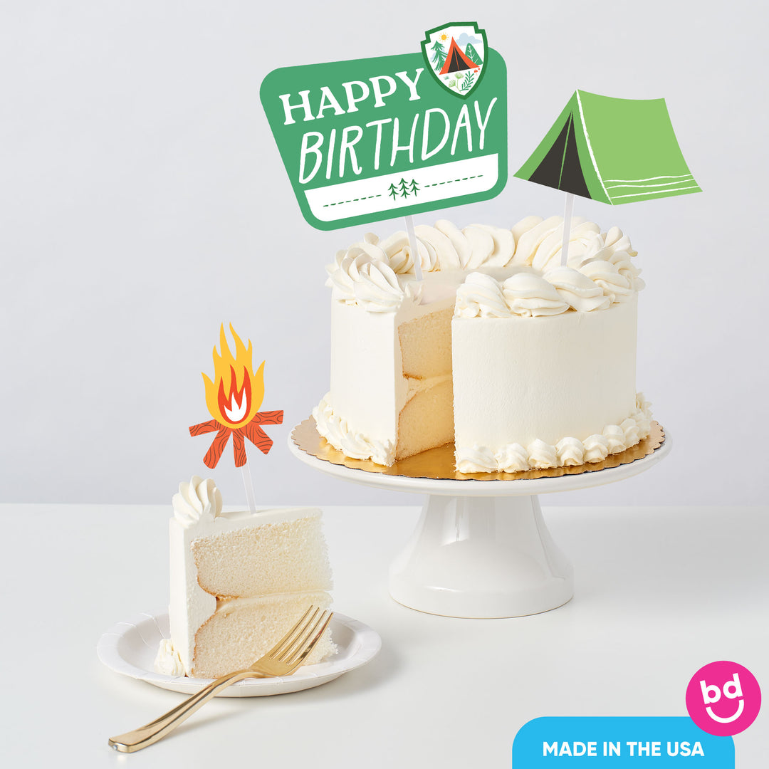 Camping birthday cake styled with toppers