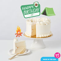 Camping birthday cake styled with toppers