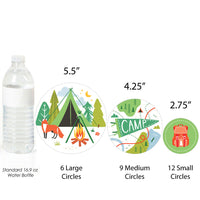 Camping themed confetti close-up with tents and campfire designs
