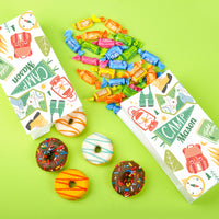Camping birthday party snack table with custom bags