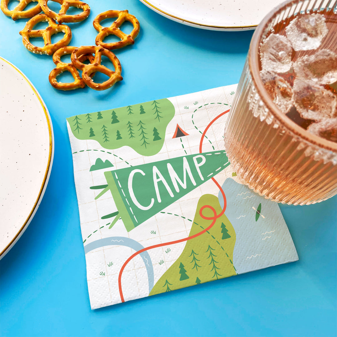 Camping birthday party table setting with napkins