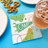 Camping birthday party table setting with napkins