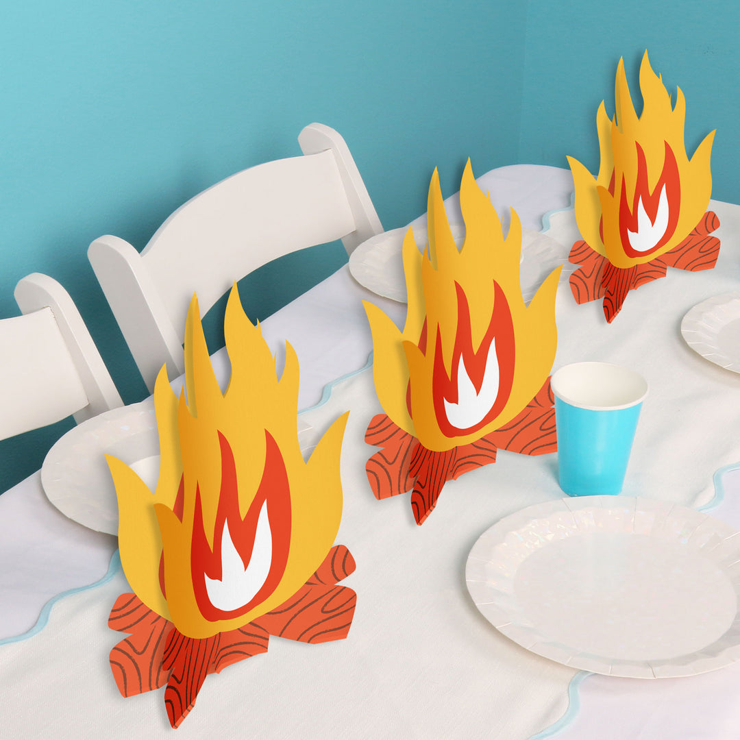 Camping birthday party table styled with centerpieces