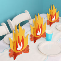 Camping birthday party table styled with centerpieces