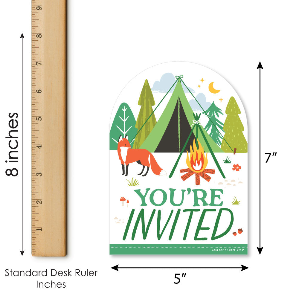Invitation card with camping design, fox, and campfire next to a ruler for size reference.