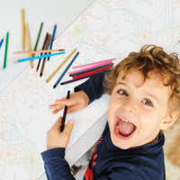 Kids coloring capybara table runner at birthday celebration