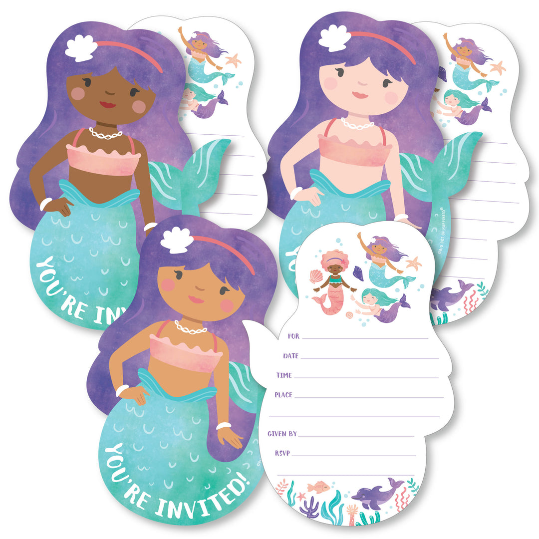 A set of mermaid-shaped fill-in invitations with space to add party details, accompanied by white envelopes. The invitations feature illustrated mermaids with different skin tones and accessories.